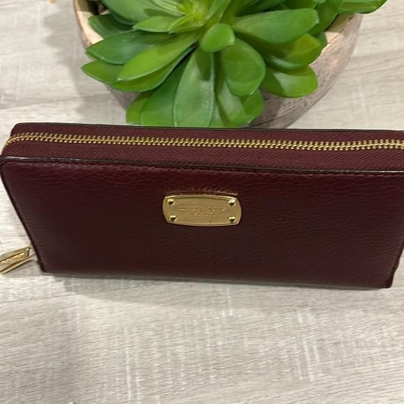 Michael Kors Handbags - Michael Kors~Pebbled Long Leather zip around wallet in Burgundy